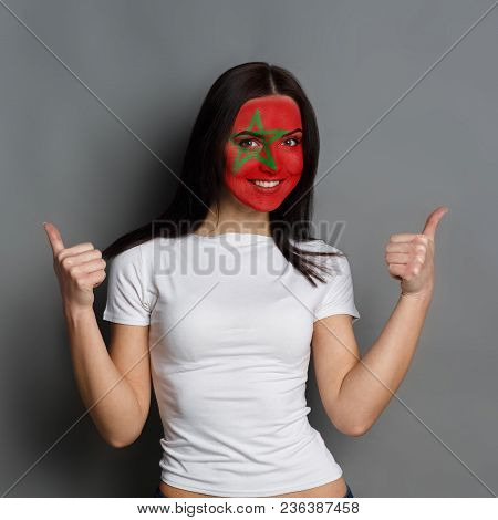 Portrait Of Happy Woman With The Flag Of Morocco Painted On His Face. Football Or Soccer Team Fan, S