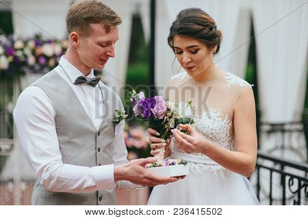 Bride And Groom Exchange Rings At The Wedding