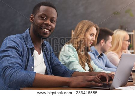 Team Of Young Programmers Working In Software Developing Company, Typing On Laptops, Testing New Gam