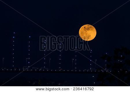 Super Blue Blood Moon Behind Bosphorus Bridge In Istanbul City, Turkey