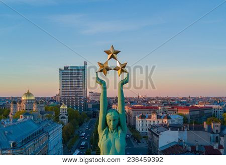 Beautiful Sunset View In Riga By The Statue Of Liberty - Milda.