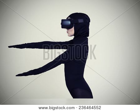 Vr Posing And Showing Off Of A Woman In Black Suit. Experiencing The Virtual Reality Helmet. Hi-tech