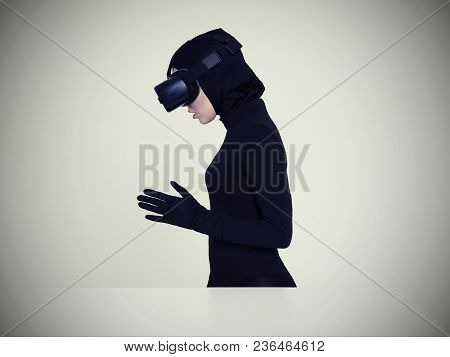 Woman Is Posing In Vr Headset. An Excited Woman Experiencing The Virtual Reality Helmet. Hi-tech Gad