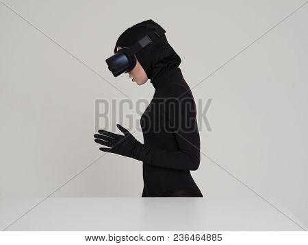 Woman Is Posing In Vr Headset. An Excited Woman Experiencing The Virtual Reality Helmet. Hi-tech Gad