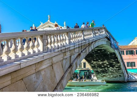 Venice, Italy - September  23, 2017 Ponte Degli Scalzi Bridge Grand Canal Tourists Boats Venice Ital