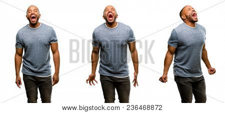 African american man with beard stressful, terrified in panic, shouting exasperated and frustrated. Unpleasant gesture. Annoying work drives me crazy