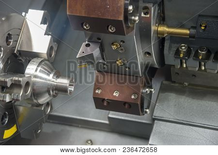 The Cnc Turning Or Lathe Machine Cutting The Thread At The End Of Metal Cone Shape Part.