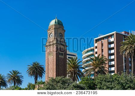 Clock Tower In St Kilda Suburb Of Melbourne With Palm Trees On The Background