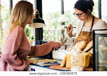 Customer ordering pasrty at counter