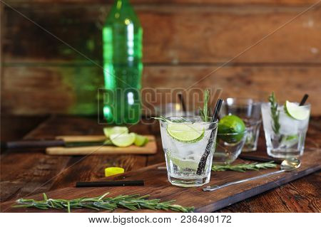 Refreshing Mint Cocktail Mojito With Rum And Lime, Cold Drink Or Beverage With Ice On Black Backgrou