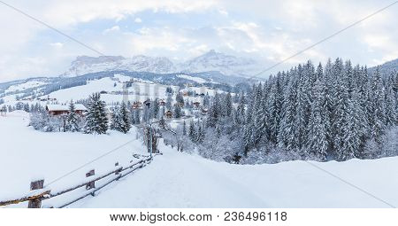 Amazing Panoramic View On The Winter Valley Village In The Dolomite Mountains Near Alta Badia. Aston