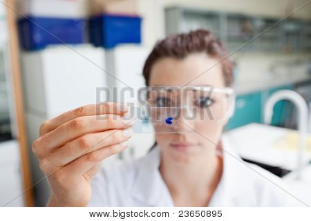 Science Student Looking At A Microscope Slide