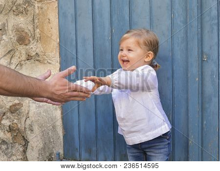 Father Holding His Beauty Aughter The Hands