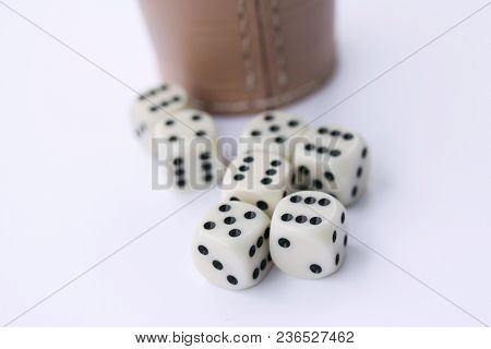Dice Game With Dice Cup On Green Table Casino Concept
