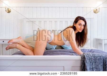A Portrait Of A Beauriful Woman In A Lingerie