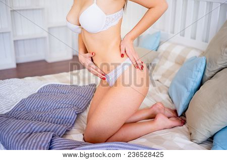 A Portrait Of A Beauriful Woman In A Lingerie