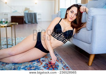 A Portrait Of A Beauriful Woman In A Lingerie