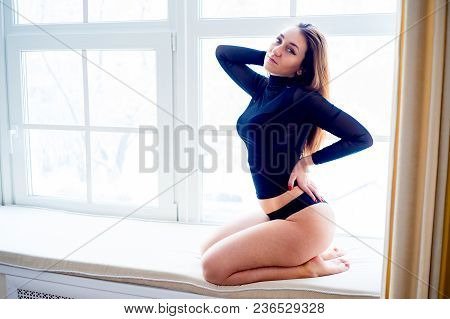 A Portrait Of A Beauriful Woman In A Lingerie