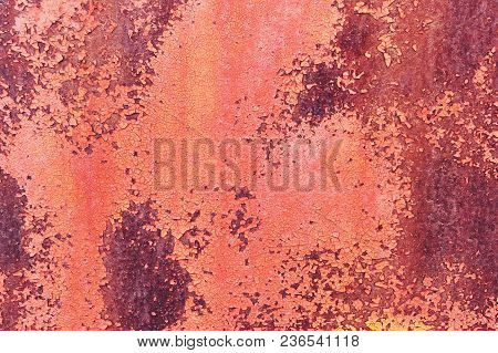 Old Rusty Metal Sheet Colored Red Paint Cracked. Abstract Background. Metallic Background.