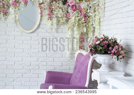 Room Decorated With Flowers And Mirror In Loft Interior Room With Vintage Style Sofa