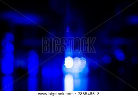 Blue Blisters On A Dark Background. Abstraction. Blue, Black. Blinked, Beacons Of Light In The Dark.