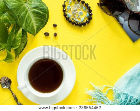 Vacation Concept, Summer Green Leaves Plant Coffee Cup Sunglasses Bracelet Hat Clothes Coffee On Yel