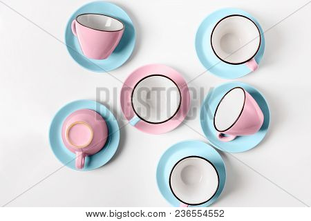 Clean Coffee Or Tea Set. Plenty Of Elegant Porcelain Light Blue Saucers And Pastel Pink Cups And At 