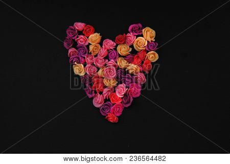 Mix Of Pink And Peach Fake Plastic Mini Rosess Flowers Black Background Copy Space. Craft, Art,