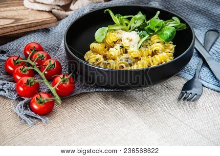 Radiatori pasta in a creamy tomato parmesan cheese sauce