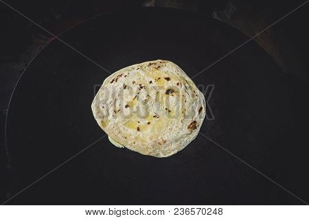 Paratha. Plain Wheaten Flat Bread Isolated On Black Background Top View. Fresh Homemade Flatbread Al