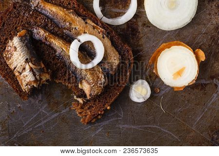 Sprat On A Piece Of Black Bread. Fish With Bread