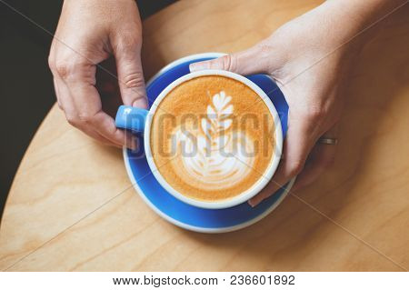Woman's Hand Lolding A Coffee.
