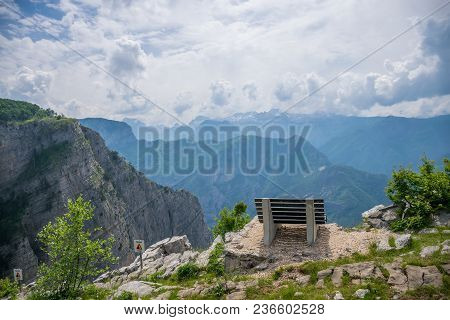 A Picturesque Bench For Meditation Is On Top Of A Cliff.