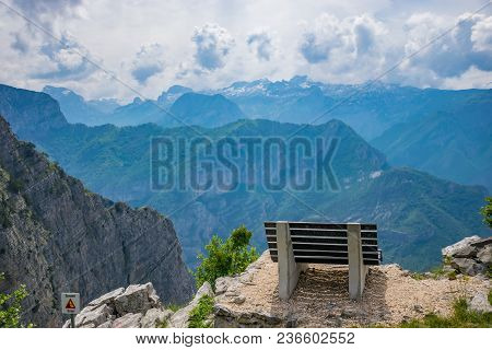 A Picturesque Bench For Meditation Is On Top Of A Cliff.