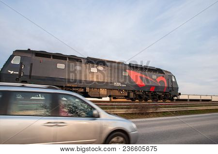 Vordingborg Denmark - March 31. 2017: Dsb Me Locomotive Passing A Car