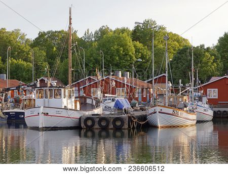 Grisslehamn, Sweden - Jul 08, 2017: Morning Light And Traditional Fishing Boats In The Small Harbor,
