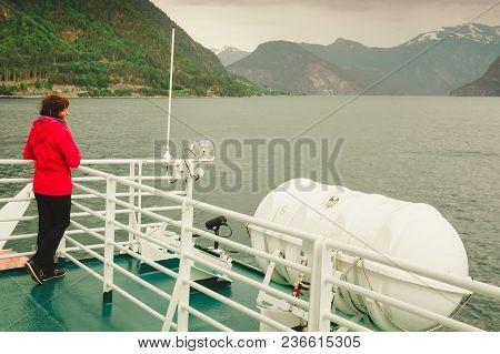 Travel Holiday And Tourism. Tourist Woman On Cruise Ship Boat Enjoying Fjord Norddalsfjorden View, N