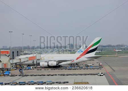 Amsterdam Airport Schiphol  The Netherlands -  April 14th 2018: A6-edu Emirates Airbus A380 At The G