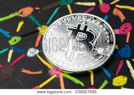 Bitcoin Cryptocurrency With Decentralized Blockchain System Concept, Physical Shiny Silver Coin On C