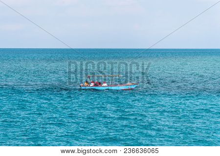 A Small Boat Floats On The Sea. Beautiful Sea Landscape. Fishermen Are Going In The Sea For Fishing 