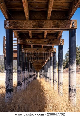 A Wooden Boardwalk Over A Dried Up Lakebed. A Victim Of The Drought And Time.