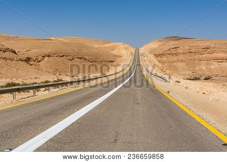 Asphalt Road In Desert Negev, Israel, Road 40, Transport Infrastructure In Desert, Scenic Mountains