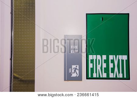Green And White Fire Exit Sign (guidance To Wayout)