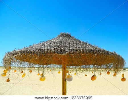 Umbrella On The Sundy Sunny Beach And Blue Sky  Portugal
