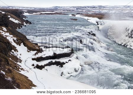 Gullfoss Waterfall In Winter. Beautiful Waterfall Gullfoss, Famous Landmark In Iceland