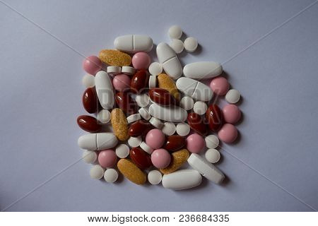 Calcium, Multivitamins, Xylitol, Lutein, Menaquinone Pills In A Heap