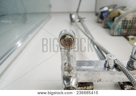 Hard Water Deposit And Rust On Shower Tap