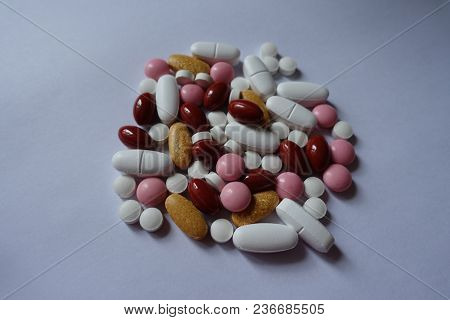 Xylitol, Lutein, Calcium, Menaquinone, Multivitamins Pills In A Heap