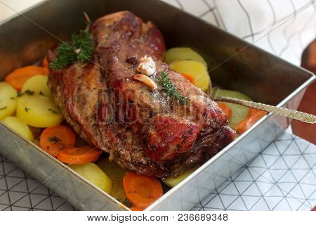 Appetizing Boiled Pork With Potatoes And Carrots, Baked In A Tin Pan. Rustic Style, Selective Focus.