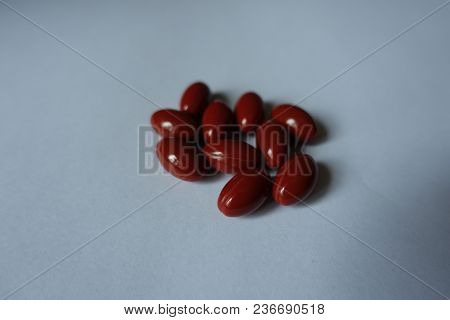 Few Red Capsules Of Lutein Dietary Supplement